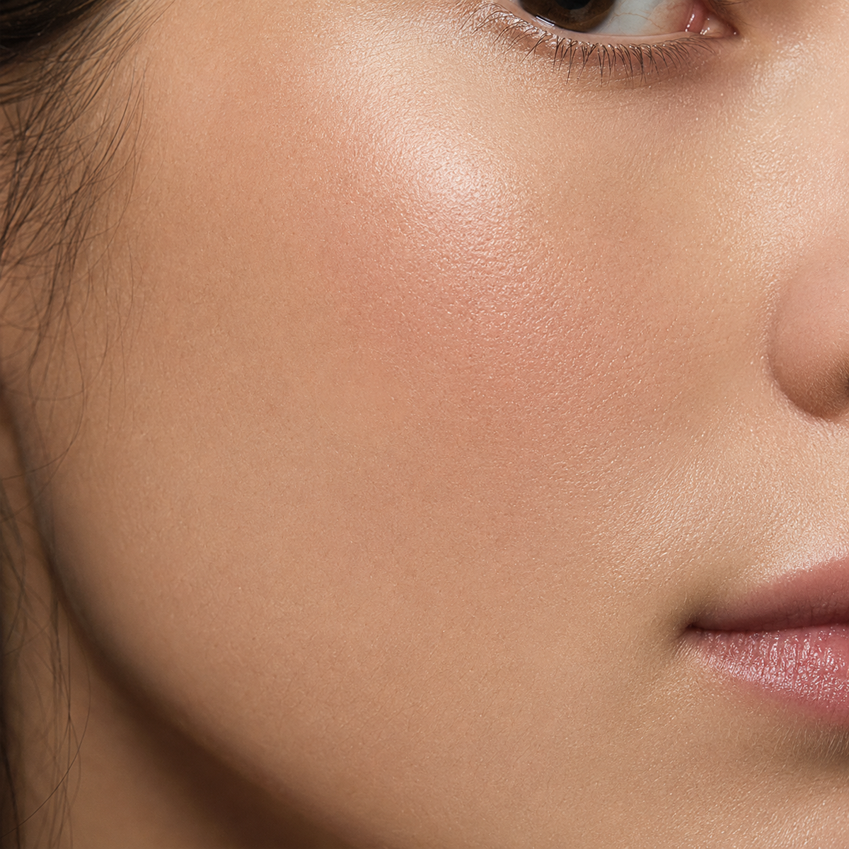 Close-up of a matte patch worn with makeup